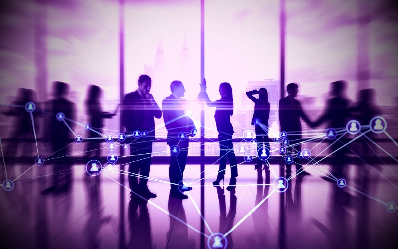 Businesspeople interacting in office building