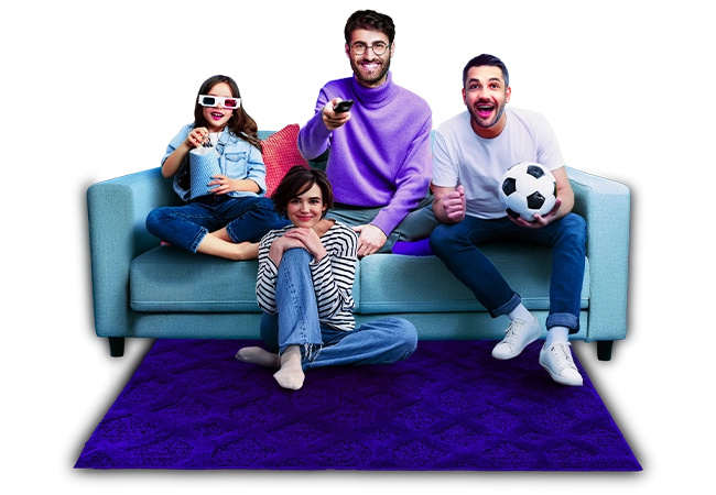 Friends and family using a TV remote to browse channels for a movie or football game.